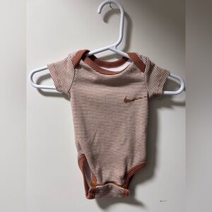 Nike Brown Striped newborn onesie